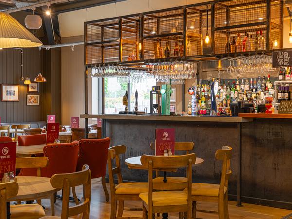 The new White Bull bar under industrial pendant lights