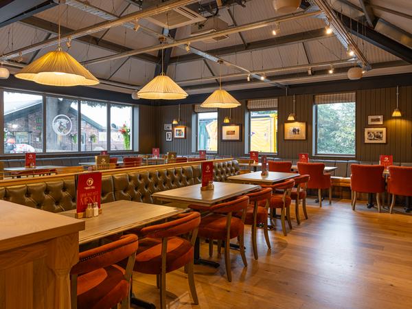 Green leather banquettes running the length of the restaurant